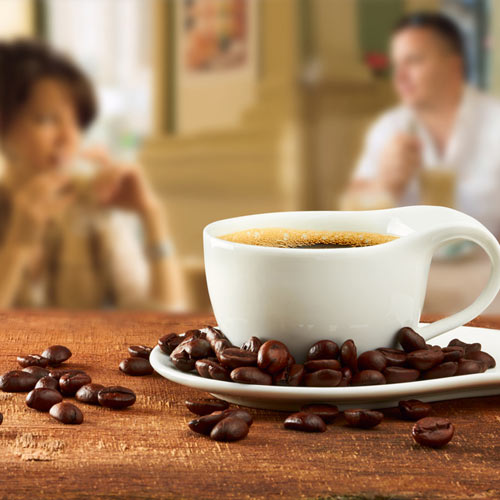 Coffee on a Table with Coffee Beans